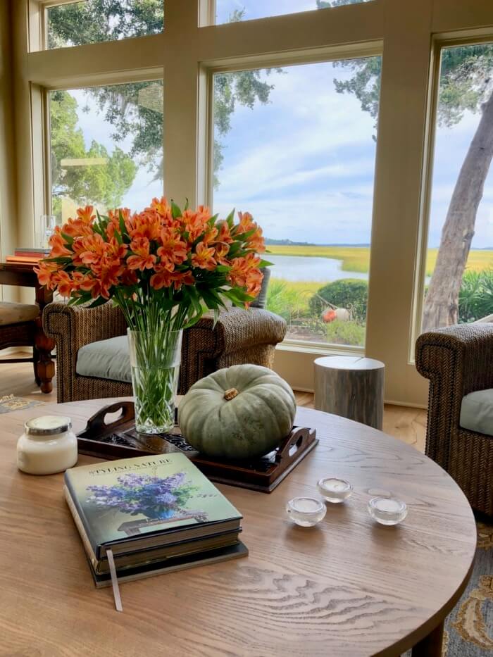 Heirloom pumpkin, orange flowers and my favorite flower book by Lewis Miller photo by Kathy Miller