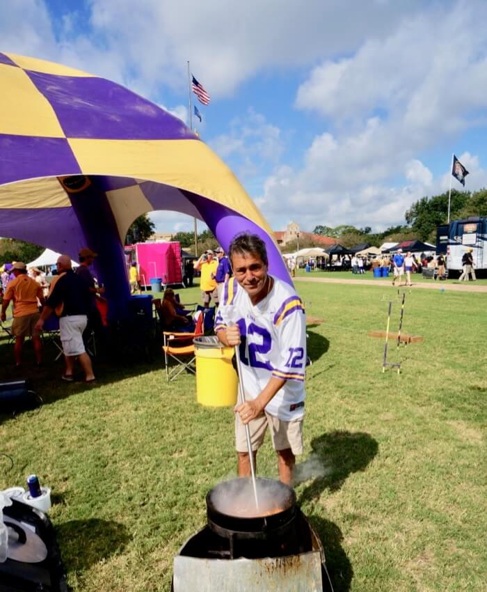 LSU fan stirring Gator Picadillo photo by Kathy Miller