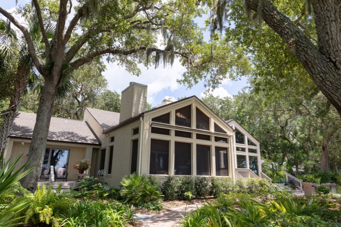 Screened porch and sunroom view from dock photo by Lynn Tennille