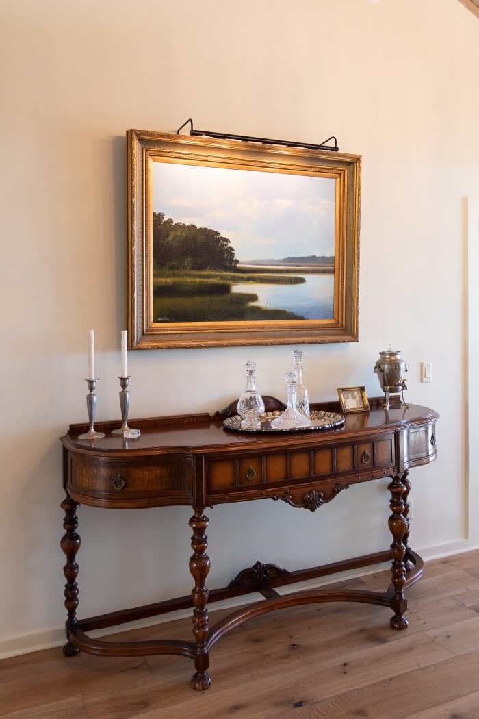 Dramatic marsh painting over dining room buffet photo by Lynn Tennille