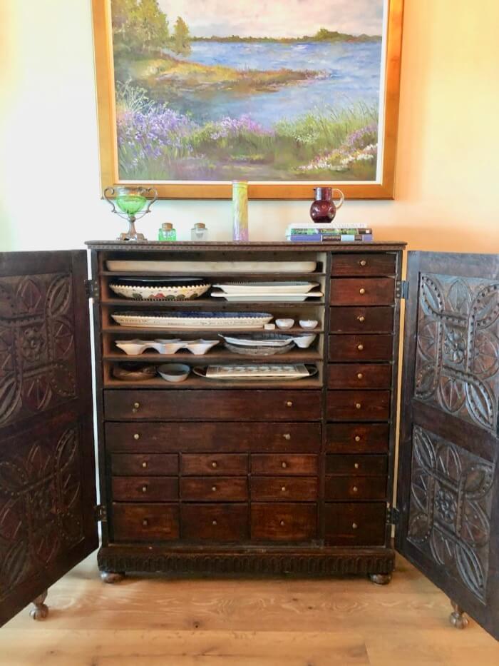 Apothecary Cabinet with platters and lots of drawers photo by Kathy Miller