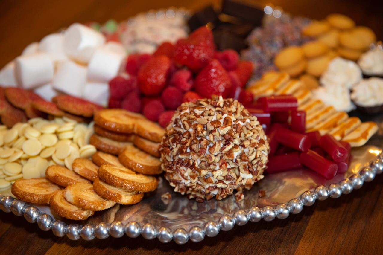 Dessert tray with Chocolate chip cheese ball and cheesecake chocolate tarts photo by Clay Greenhaw