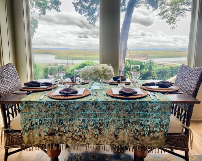 Batik fringed shawl as a table cloth with browns and turqs photo by Kathy Miller