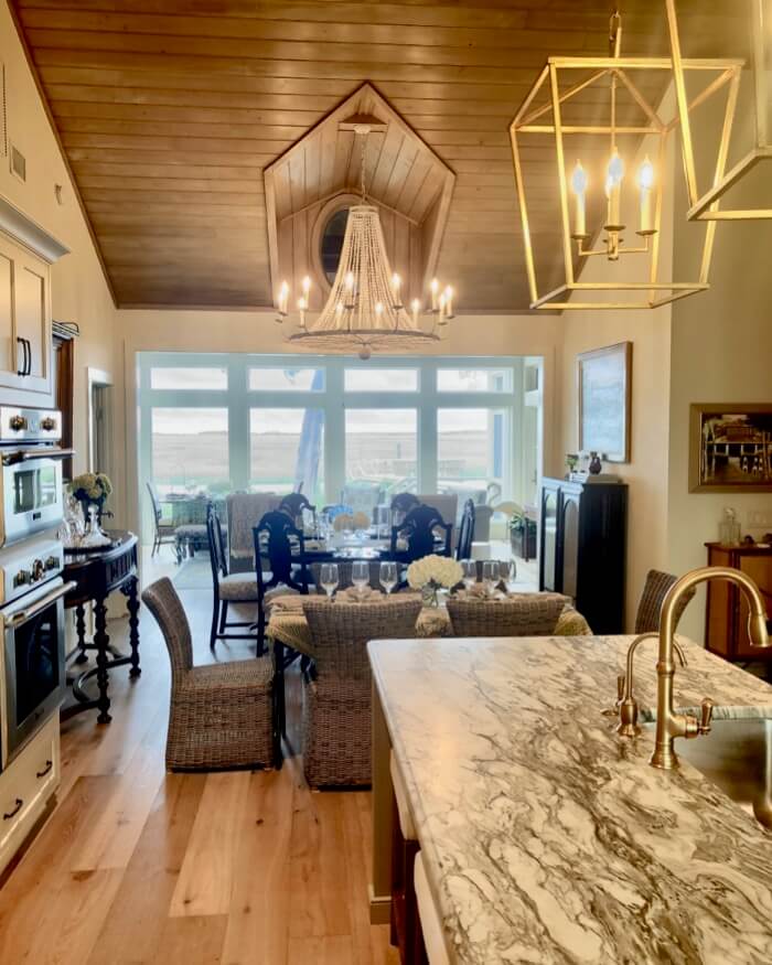 View from kitchen through dining space and sunroom to marsh photo by Kathy Miller