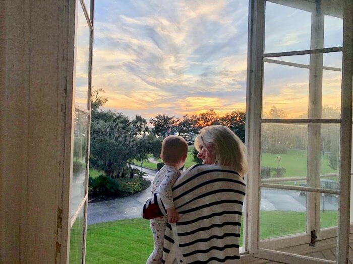 Kaki and Parks enjoy sunset from our glassed in porch photo by Kathy Miller