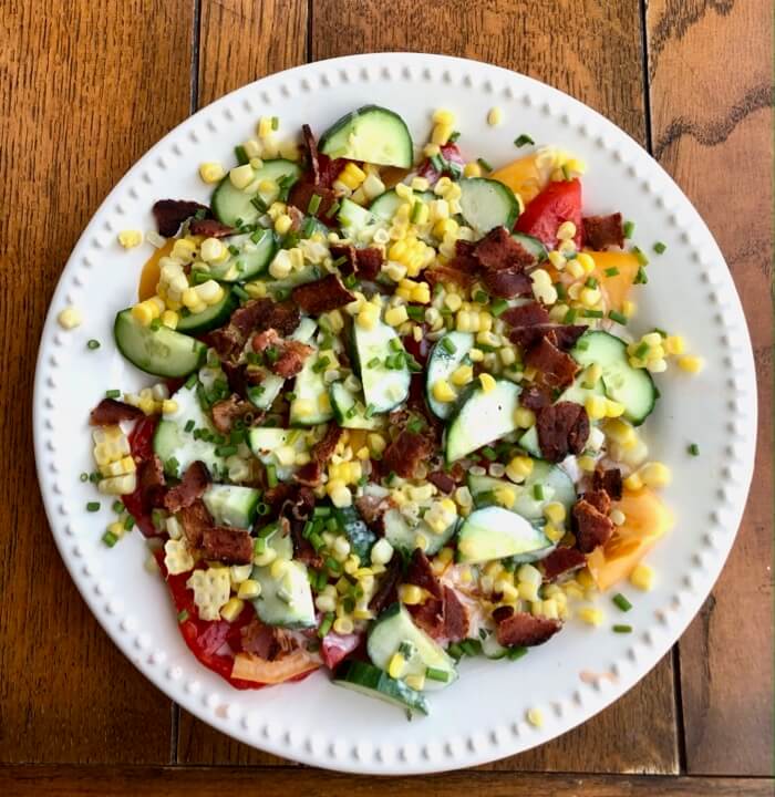 Heirloom tomato salad with Cucumber, corn and bacon, with green goddess dressing