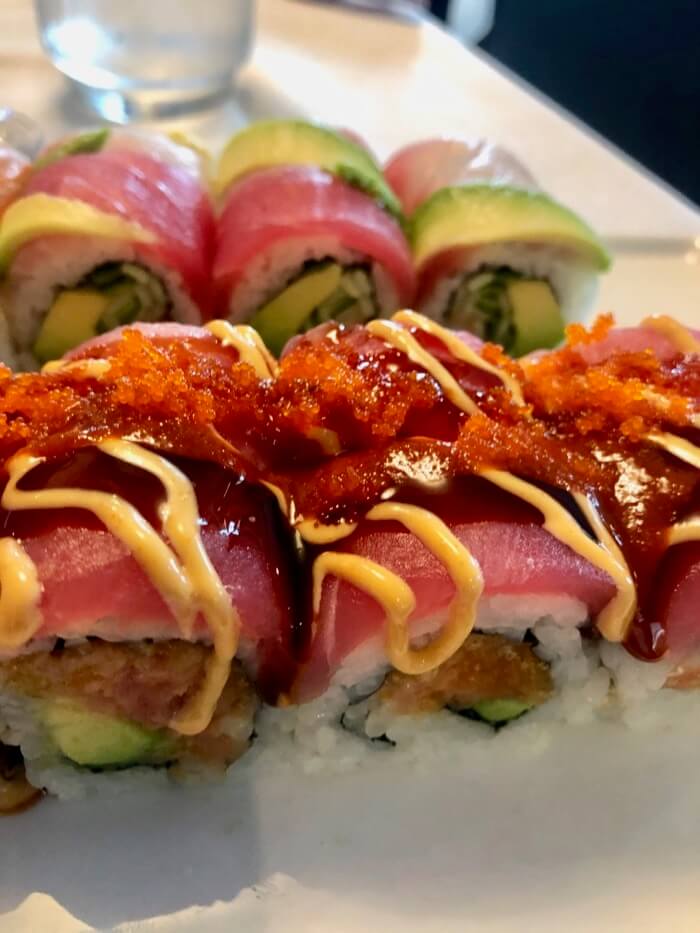 Spicy Girl Maki -Spicy salmon, avocado inside topped with fresh tuna with special sauce photo by Kathy Miller