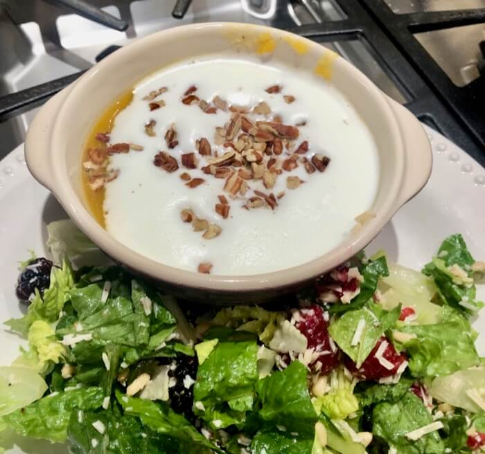 Butternut squash soup with ginger and cream on top photo by Kathy Miller