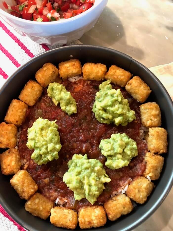 Tater tot cake bean dip and guac layer photo by Kathy Miller